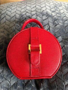 Red Round Travel Case with Gold Hardware